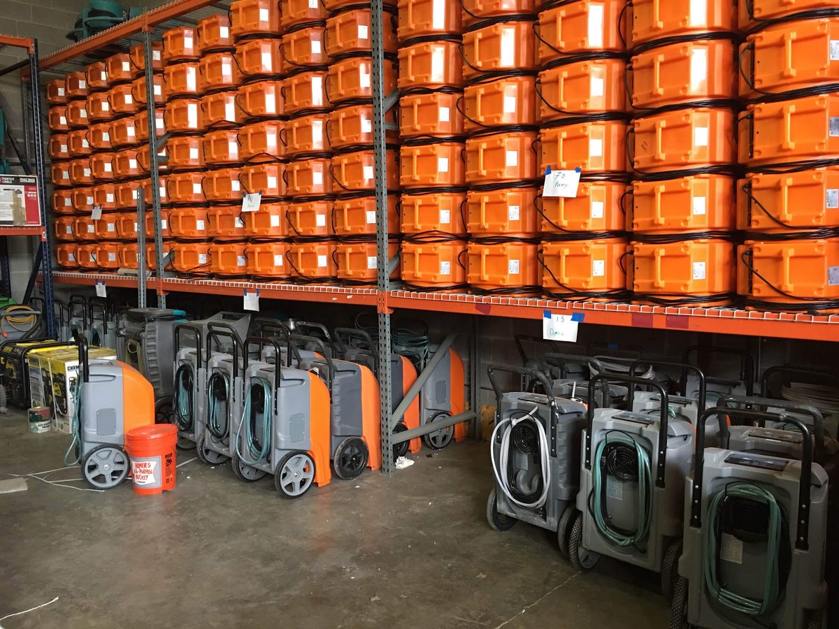 Water Damage Pro warehouse stocked with commercial air movers and dehumidifiers ready to deploy